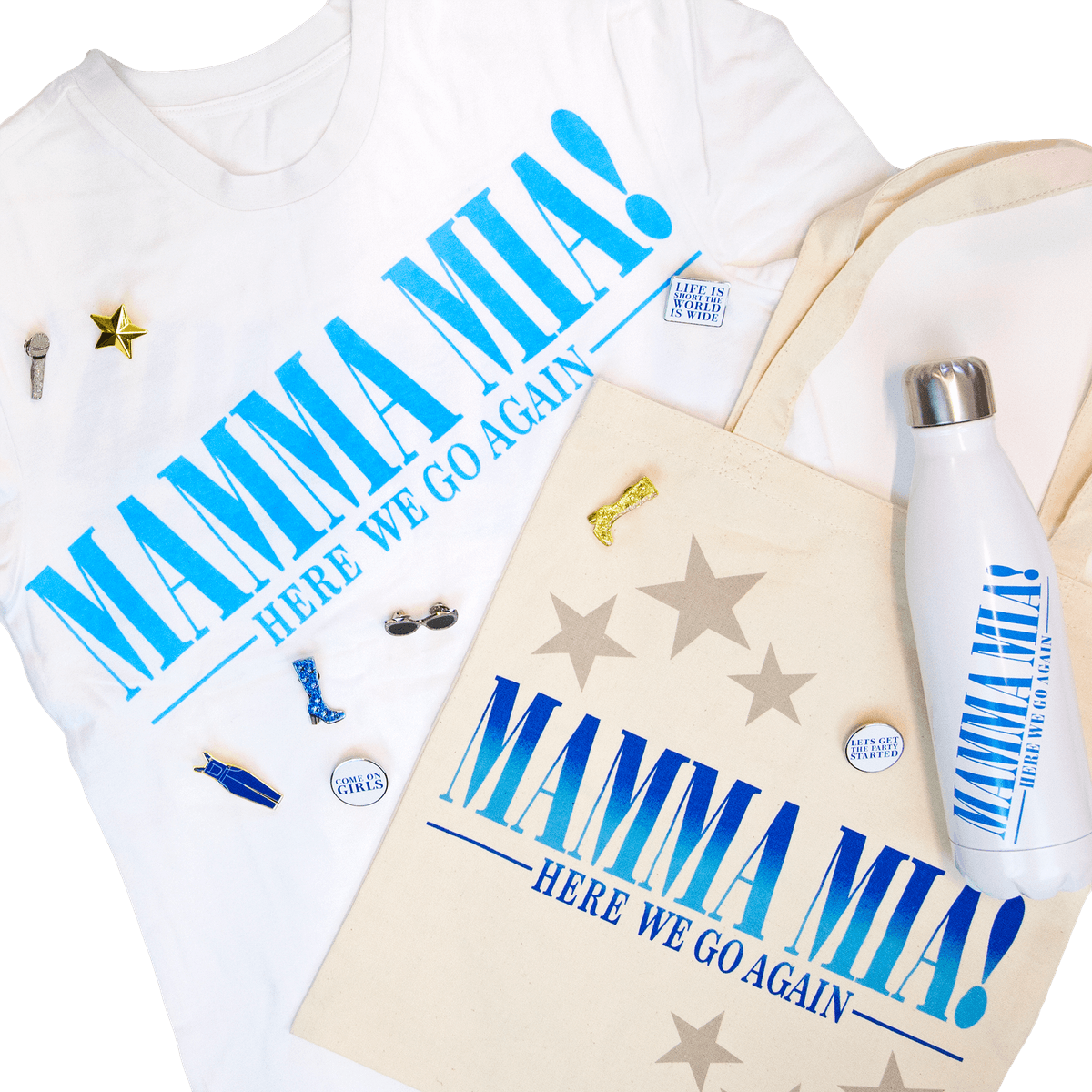 Mamma Mia! Here We Go Again merchandise: printed t-shirt, canvas tote, water bottle and enamel pin badges
