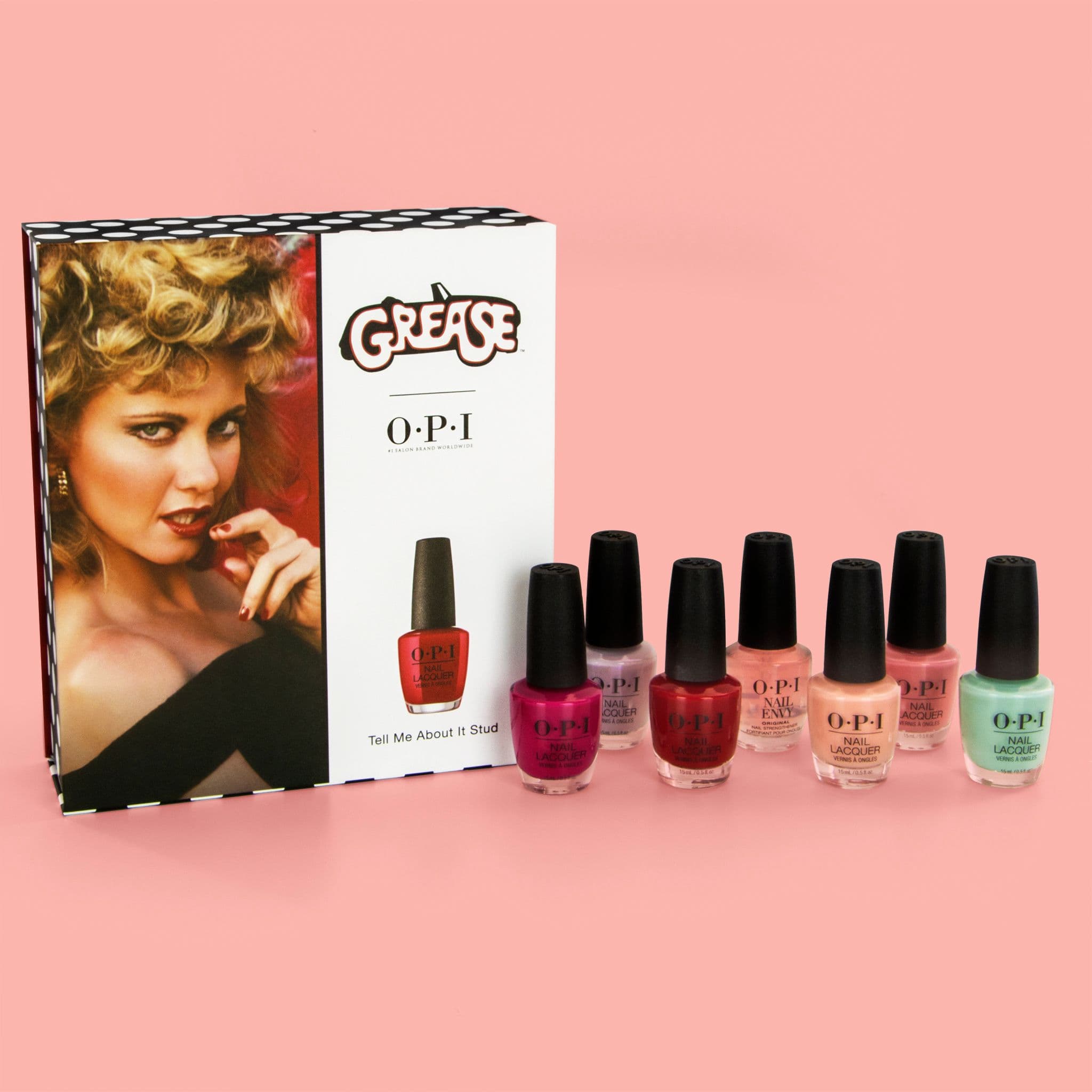 OPI x Grease presentation box featuring film artwork and co-branded graphics, displayed beside seven colourful nail lacquer bottles.