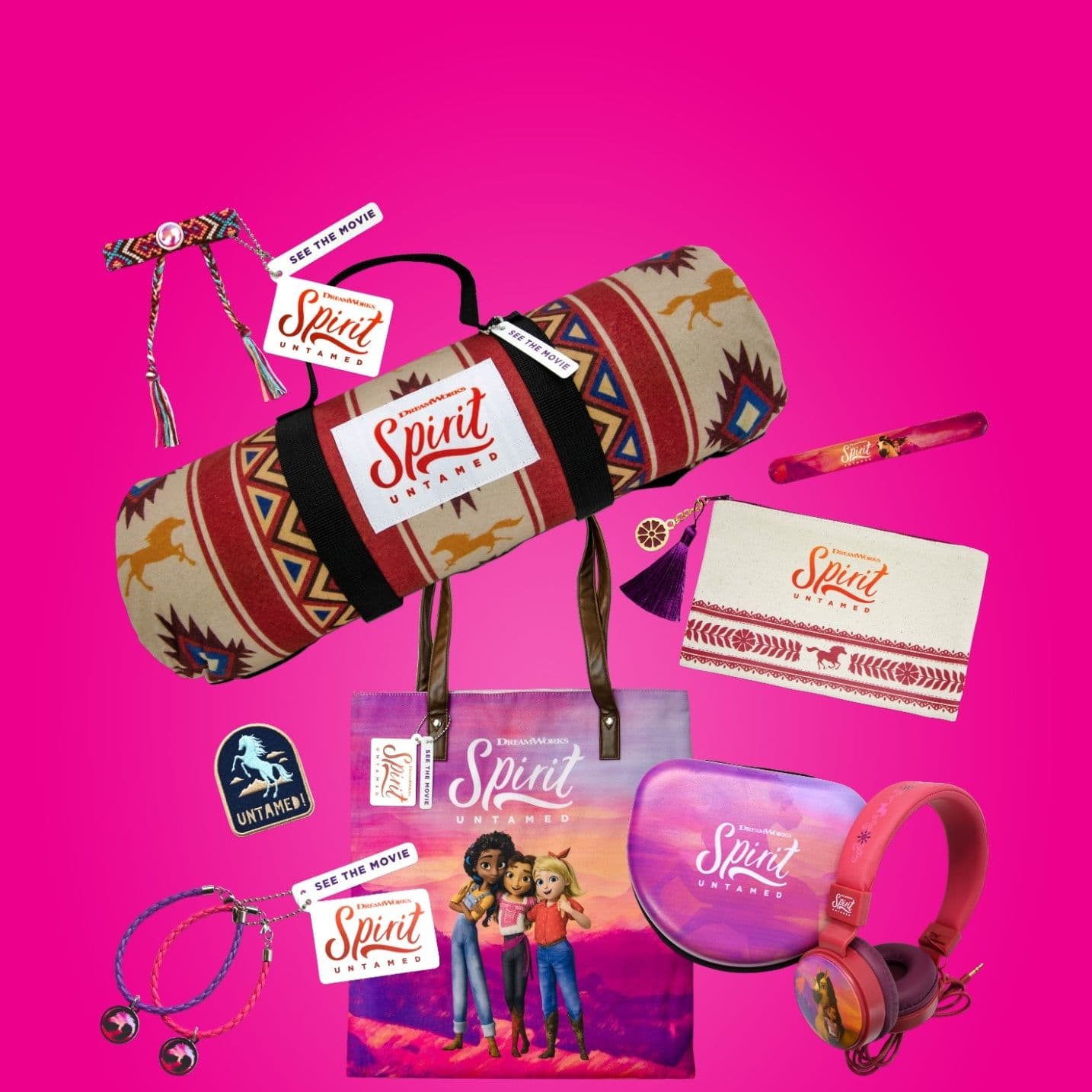 Spirit Untamed merchandise collection featuring a patterned blanket, tote bag, headphones, pencil case, friendship bracelets, wristband and promotional accessories on a bright pink background.