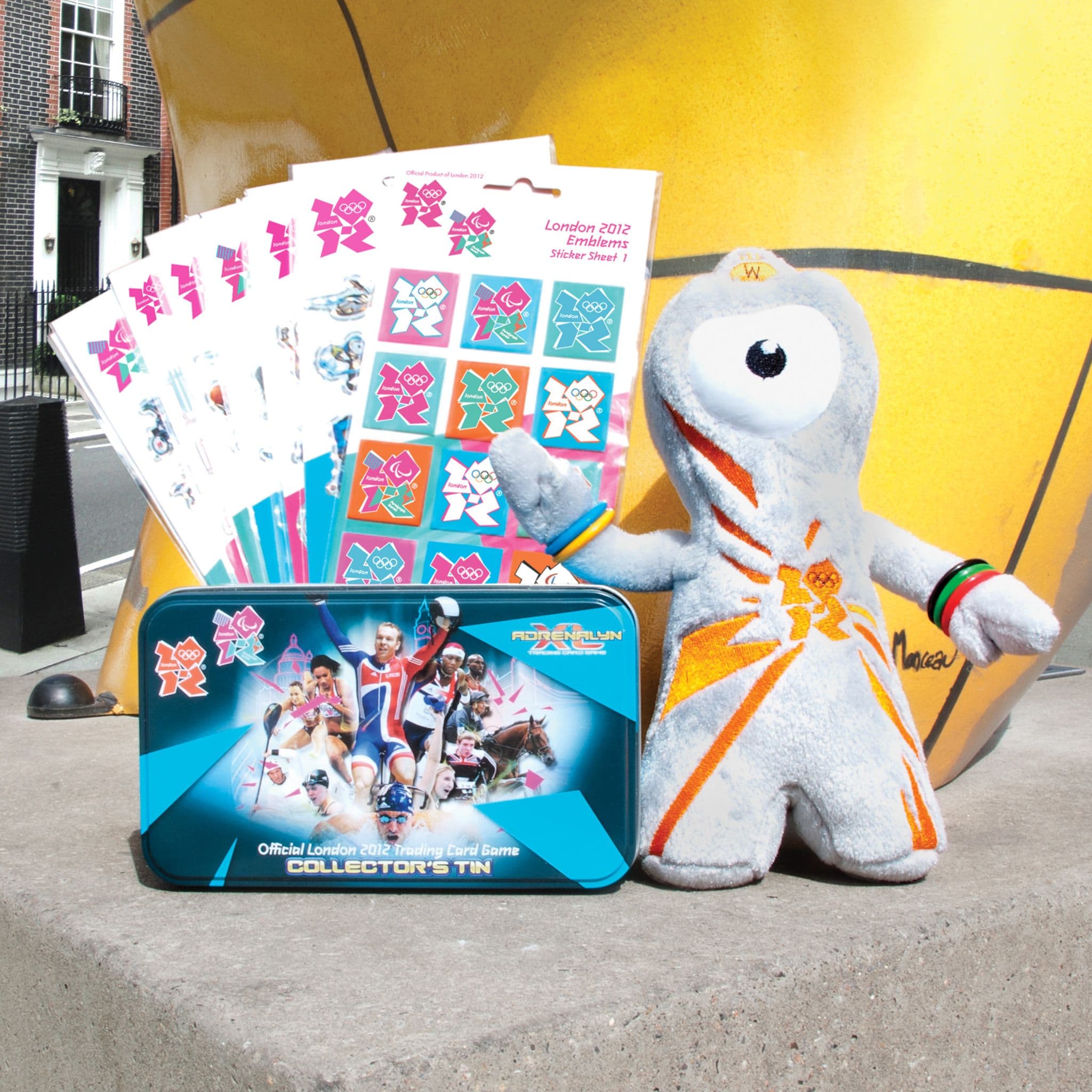 London 2012 collection featuring Olympic and Paralympic emblem sticker sheets, an official trading-card collector’s tin and a Wenlock mascot plush.