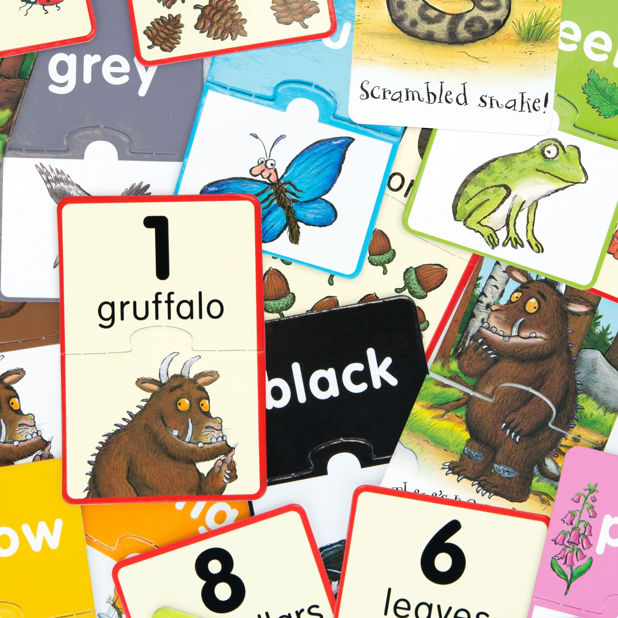 Colourful Gruffalo-themed educational puzzle pieces featuring storybook characters, woodland animals, numbers, colours and simple words.