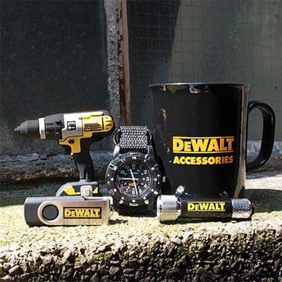 DeWalt-branded collection featuring a black mug, wristwatch, yellow-and-black drill-shaped item, torch and compact accessories.